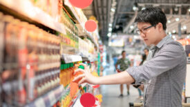 Man shopping in beverage isle