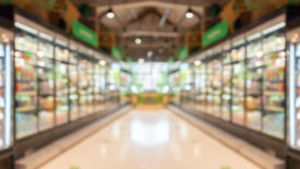 supermarket grocery store aisle and shelves blurred background