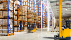 Large modern warehouse with forklifts